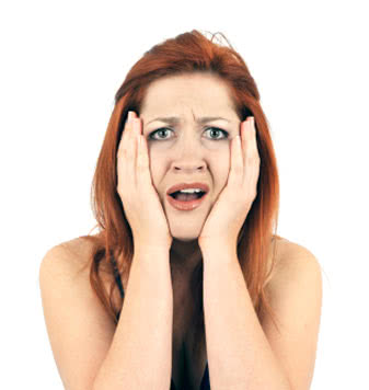 Horrified girl, hands on face